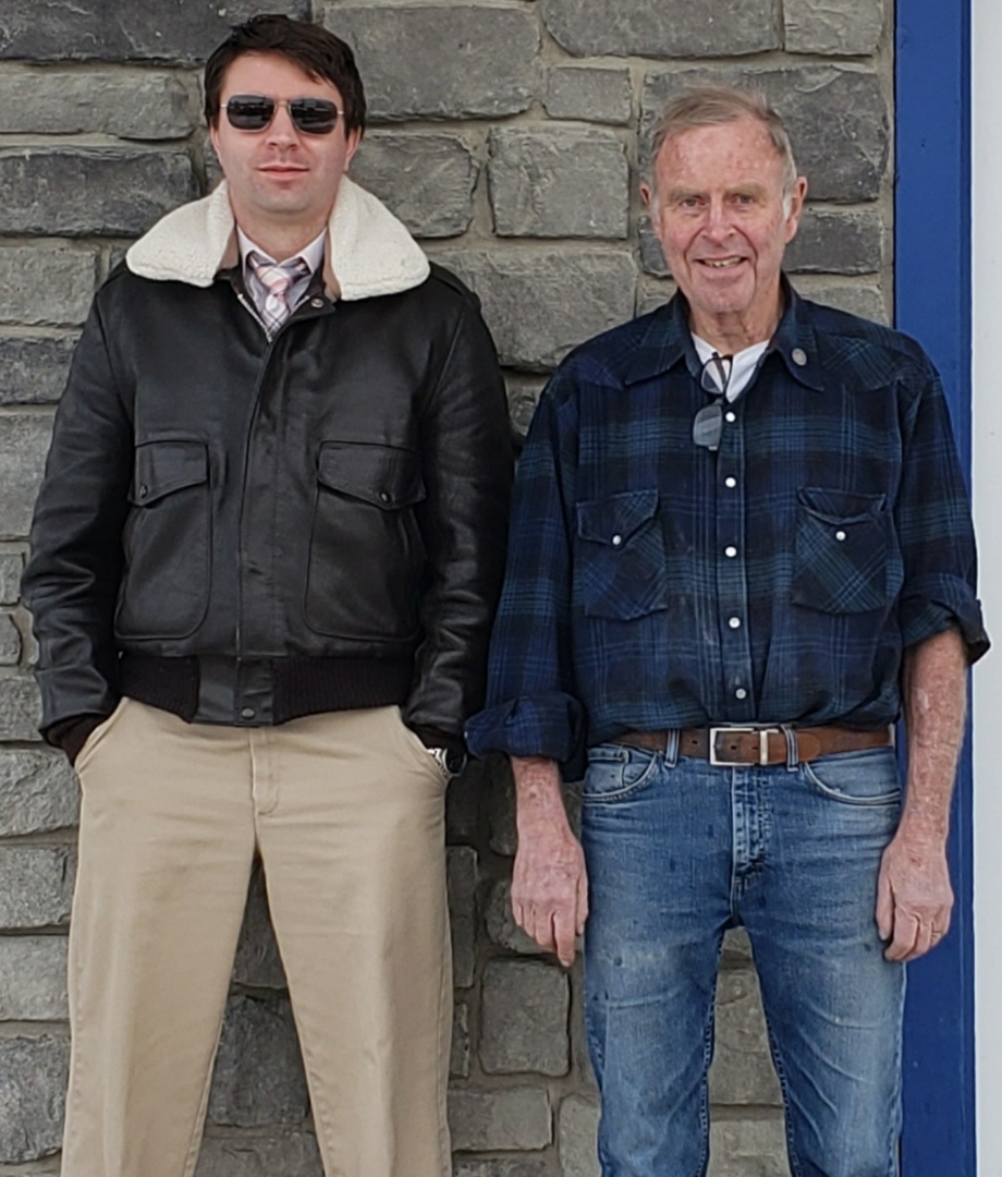 Two generations, father and son in front of the Thurston Laboratories main office.