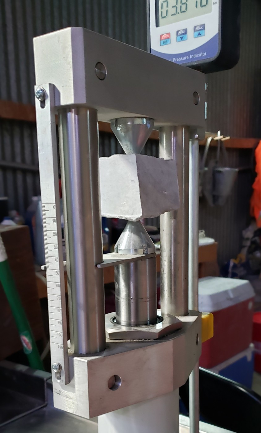 Point load test of a rock specimen between conical platens